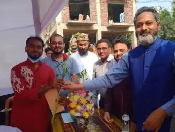 Chairman Distributing Flowers