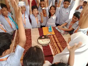 Cutting Cake by Students on Celebration